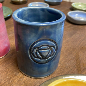 Ceramic chakra vessels and trivets by Laurel Herbert